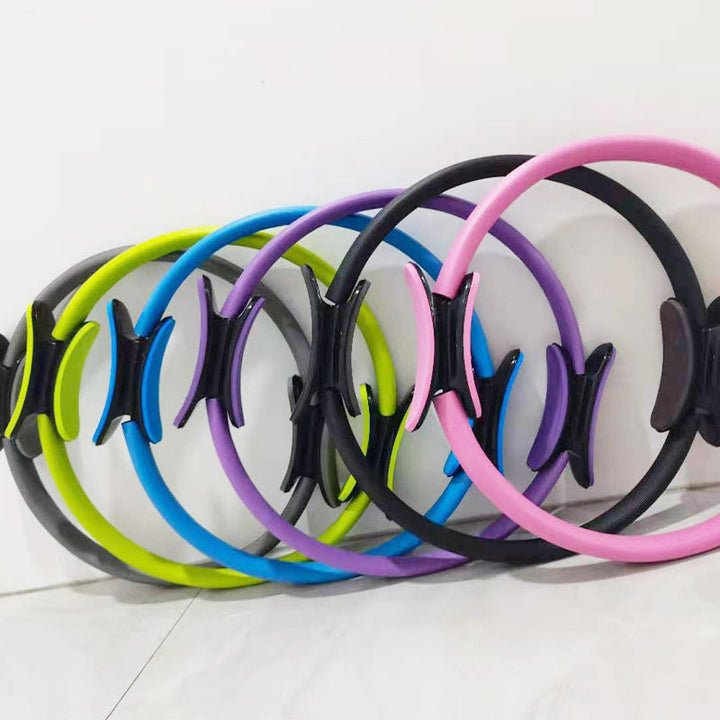 Unisex pilatescirkel i glasfiber, lämplig för hem och gym, visas i olika färger, 36 cm diameter, mjukt grepp.