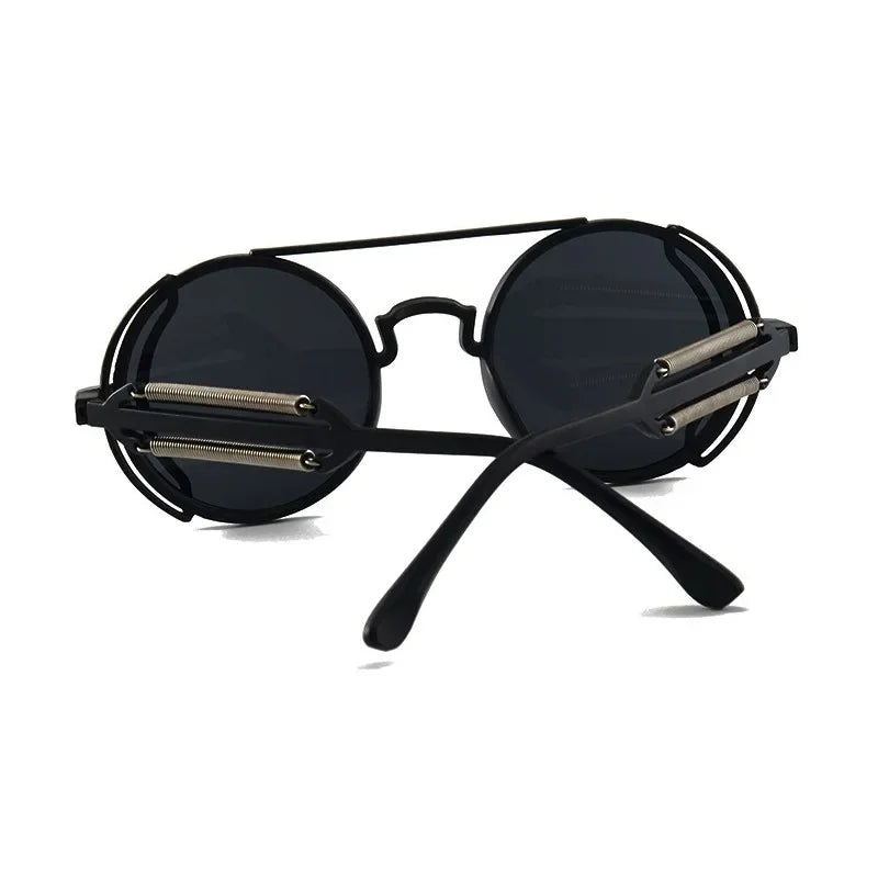 Trendiga, runda retro solglasögon med edgy design och mekaniska detaljer. Unisex accessoar för en unik look.