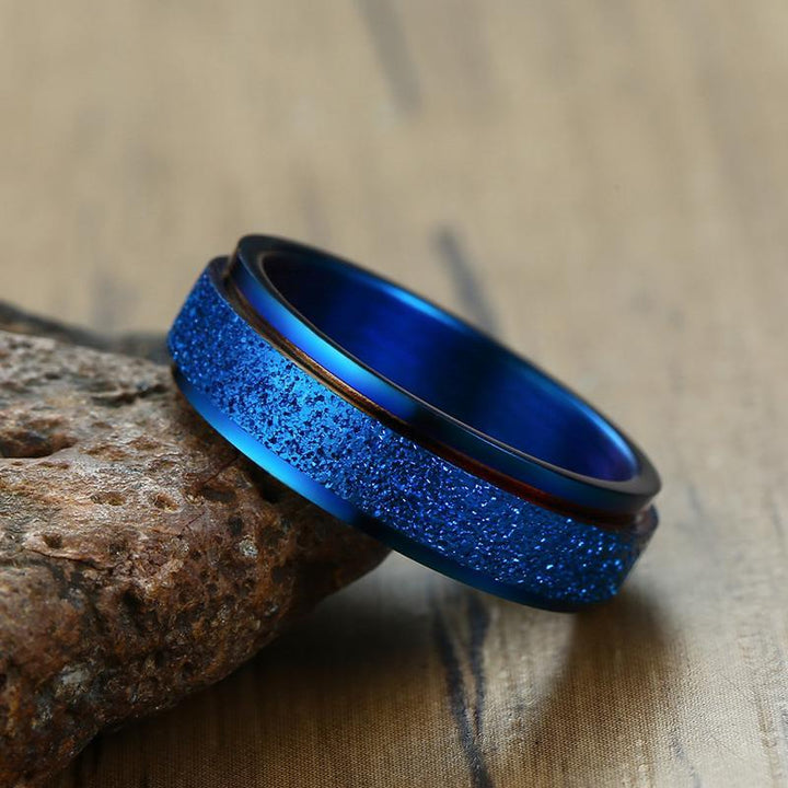 "Unisex sandblästrad roterande fidget ring i rostfritt stål, elegant och modern design, flera färger tillgängliga."