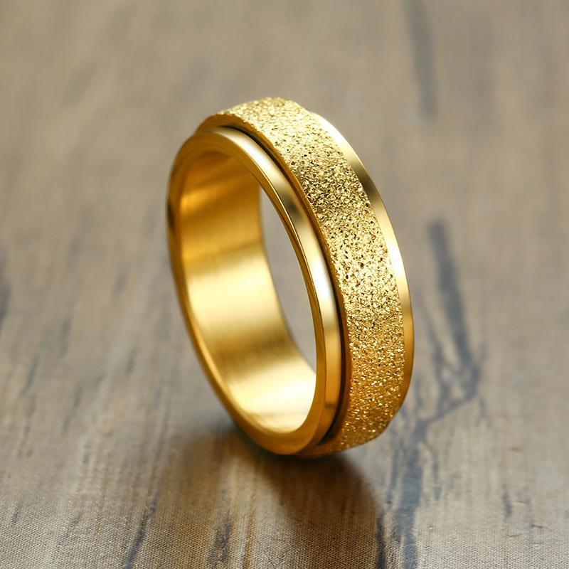 "Unisex sandblästrad roterande fidget ring i rostfritt stål, elegant och modern design, flera färger tillgängliga."