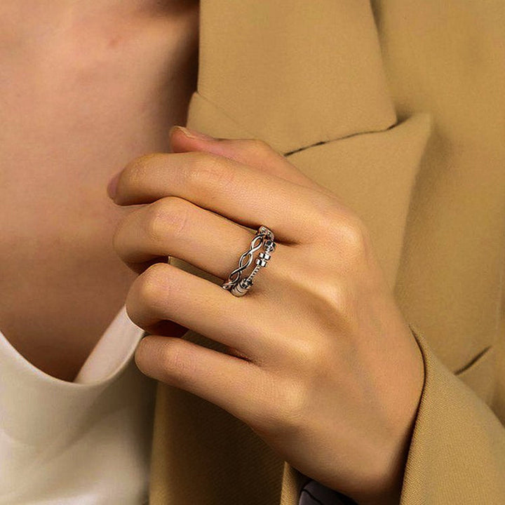 "Unisex silver infinity fidget ring med justerbar design, kedjelänkmönster, perfekt för stresslindring och stil."
