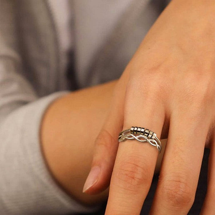 "Unisex silver infinity fidget ring med justerbar design, kedjelänkmönster, perfekt för stresslindring och stil."