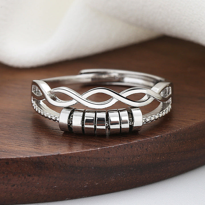 "Unisex silver infinity fidget ring med justerbar design, kedjelänkmönster, perfekt för stresslindring och stil."