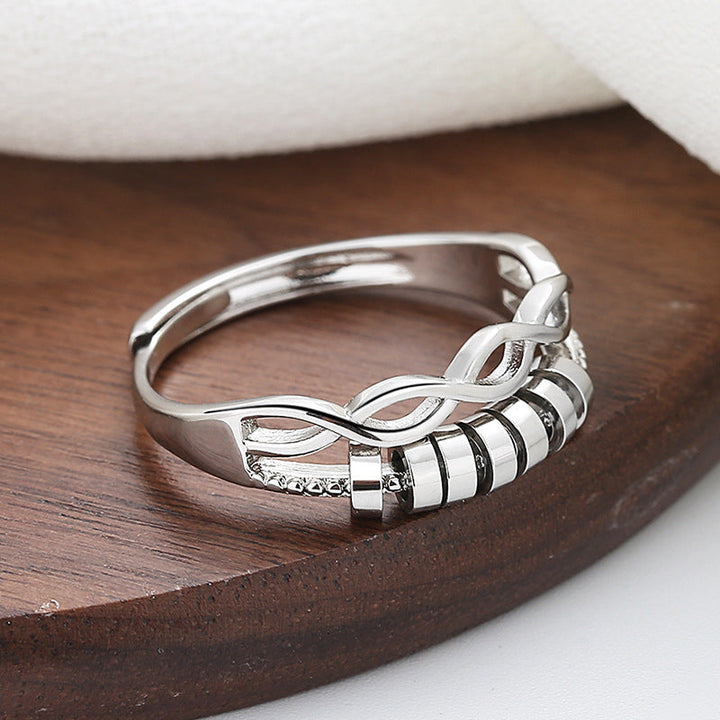 "Unisex silver infinity fidget ring med justerbar design, kedjelänkmönster, perfekt för stresslindring och stil."