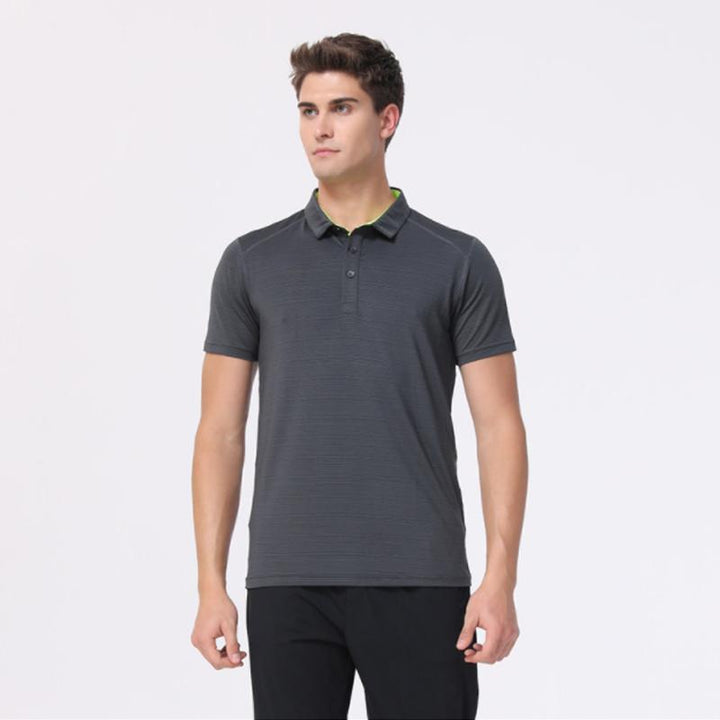 Unisex snabbttorkande pikétröja i blått med knappar och korta ärmar, perfekt för sport och fritidsbruk.