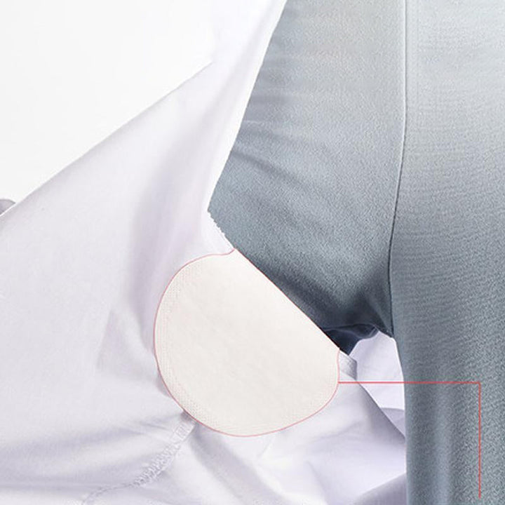 "Unisex svettabsorberande underarmsdynor, miljövänliga, vita och självhäftande, håller dig torr och bekväm hela dagen."
