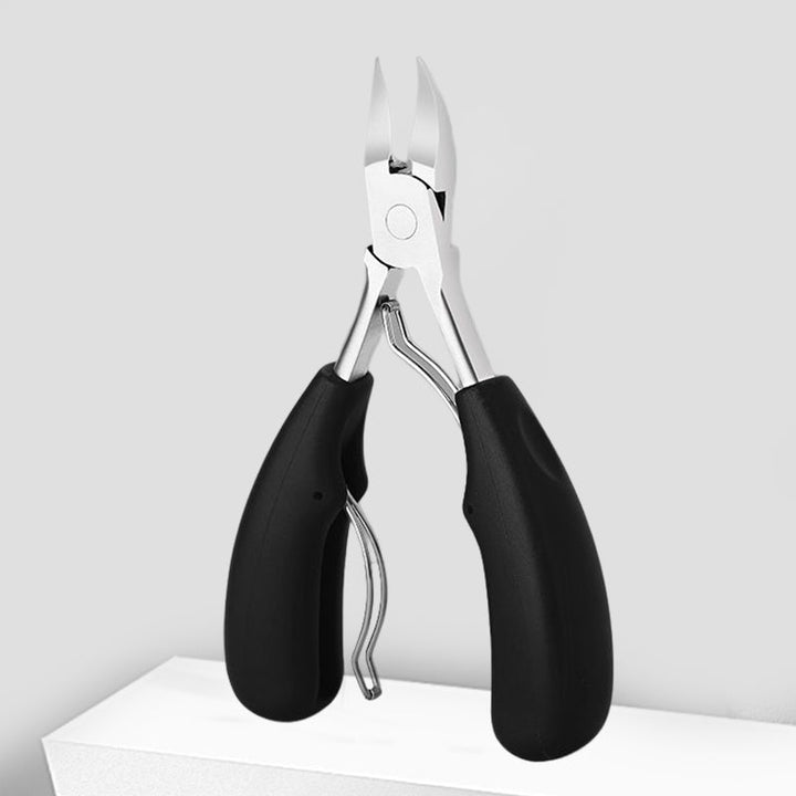"Unisex tånagelklippare i rostfritt stål med ergonomiskt grepp, böjd knivskarp design för enkel och precis nagelvård."