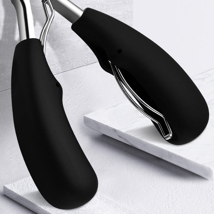 "Unisex tånagelklippare i rostfritt stål med ergonomiskt grepp, böjd knivskarp design för enkel och precis nagelvård."