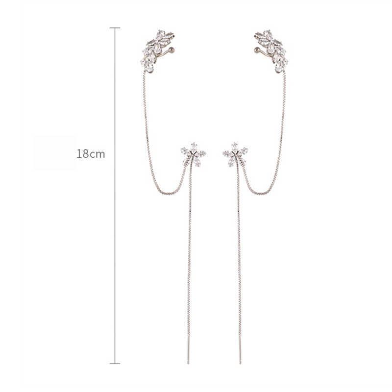 "Unisex tofs hängande örhängen med glänsande zirkoninlägg och dekorativ design, perfekta som hypoallergena accessoarer."