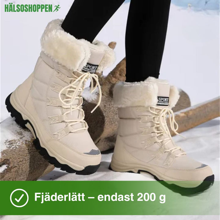 Vita isolerade unisex stövlar för kallt väder. Vattentåliga promenadskor som kombinerar stil och värme.
