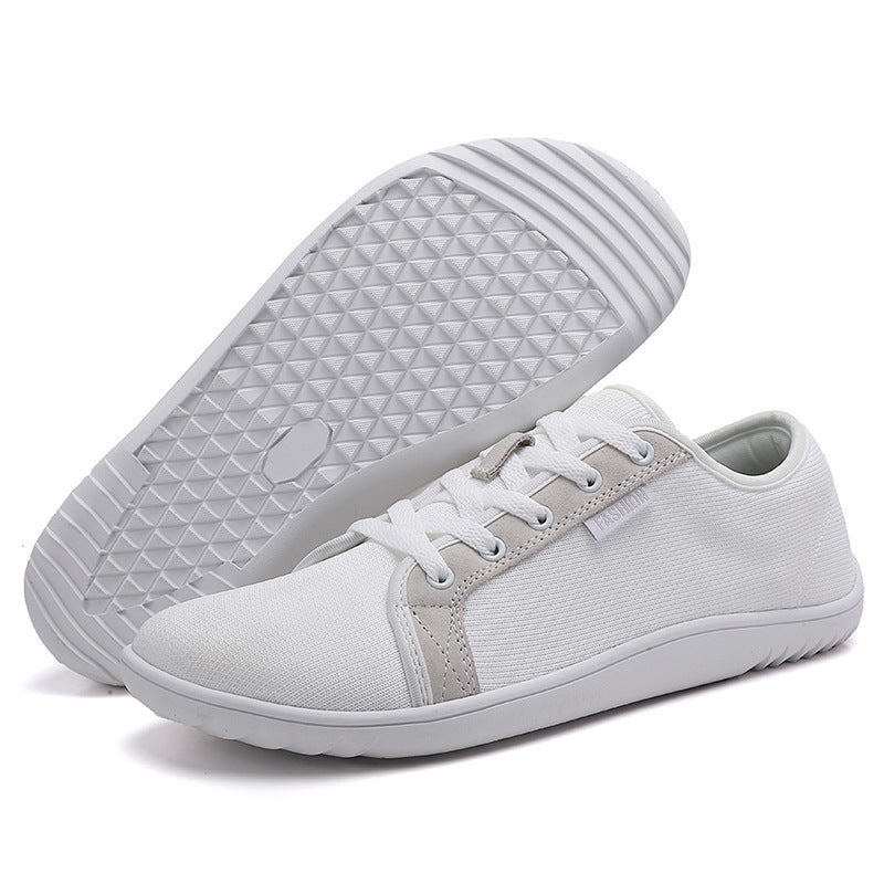 Svarta unisex zero-drop komfortskor för dagliga promenader. Bred passform och andningsbar design för naturlig gång.