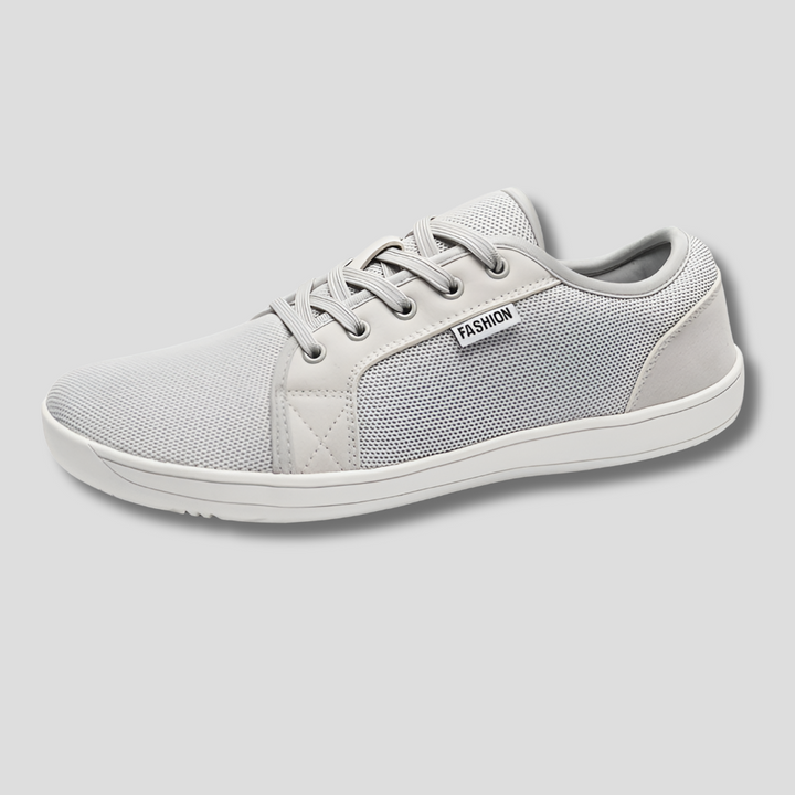 Hälsosamma zero-drop skor i grått för naturlig fotposition. Unisex, bred passform & lättvikt för komfort.