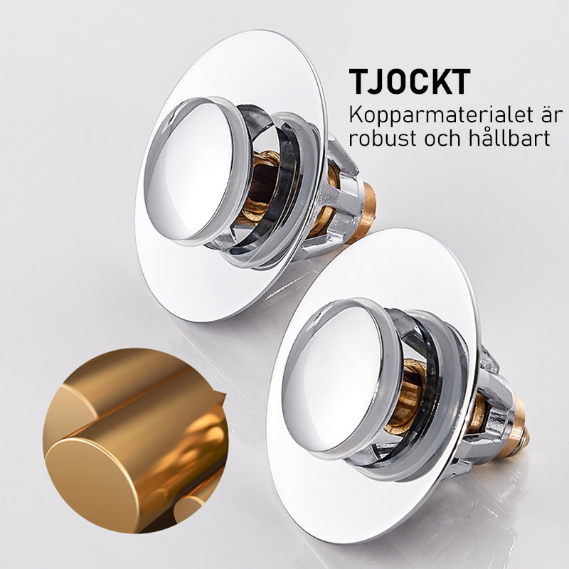 "Universal bottenventil i rostfritt stål, silverfinish, med inbyggd anti-igensättningskorg och enkel tryck-och-pop funktion."