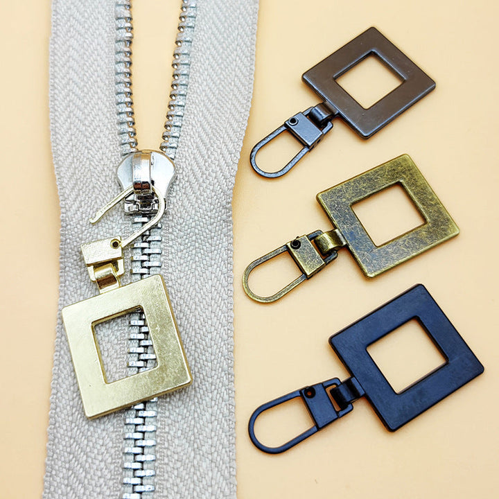 "Universalt avtagbart metallhandtag för dragkedjor, silver, perfekt för kläder och väskor, rektangulärt, robust design."
