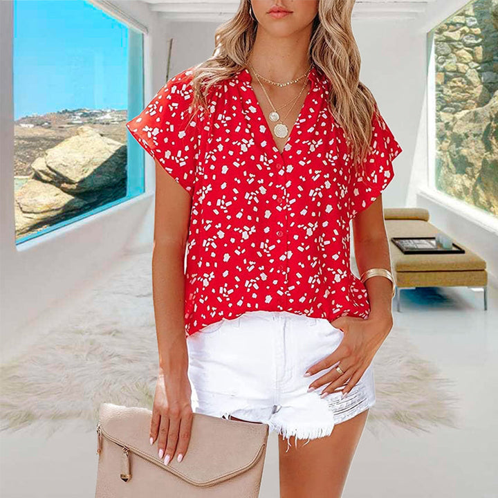 "V-ringad blommönstrad boho topp för kvinnor, lätt och luftigt material, perfekt för sommar och festliga tillfällen."