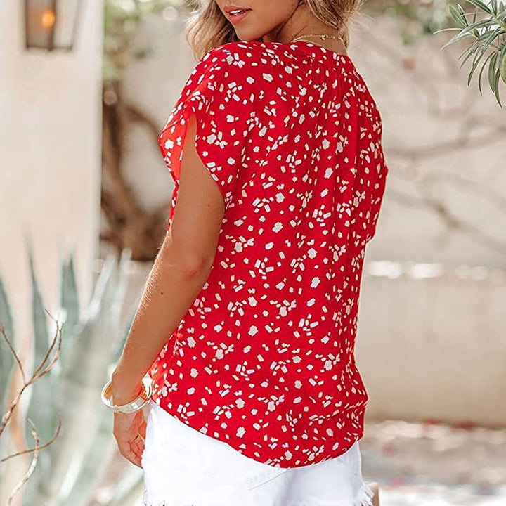"V-ringad blommönstrad boho topp för kvinnor, lätt och luftigt material, perfekt för sommar och festliga tillfällen."