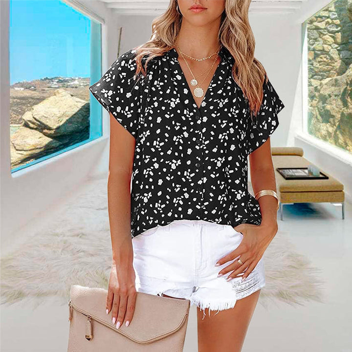 "V-ringad blommönstrad boho topp för kvinnor, lätt och luftigt material, perfekt för sommar och festliga tillfällen."