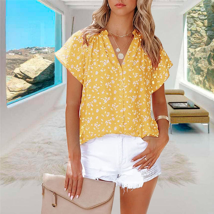 "V-ringad blommönstrad boho topp för kvinnor, lätt och luftigt material, perfekt för sommar och festliga tillfällen."