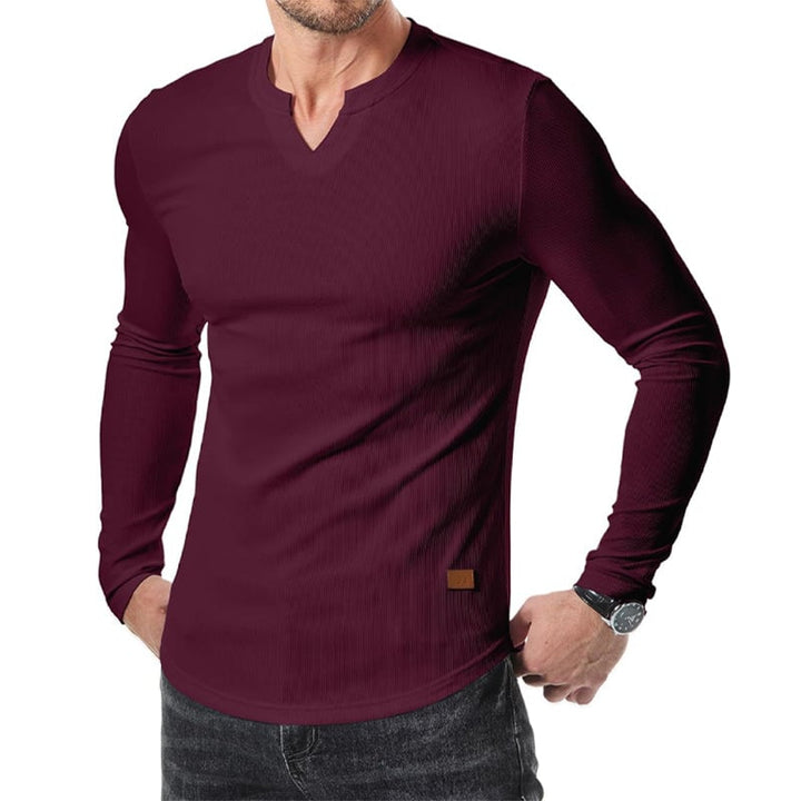 "V-ringad långärmad muskelskjorta för män med slim fit, framhäver kroppens fysik med modern design och komfort."
