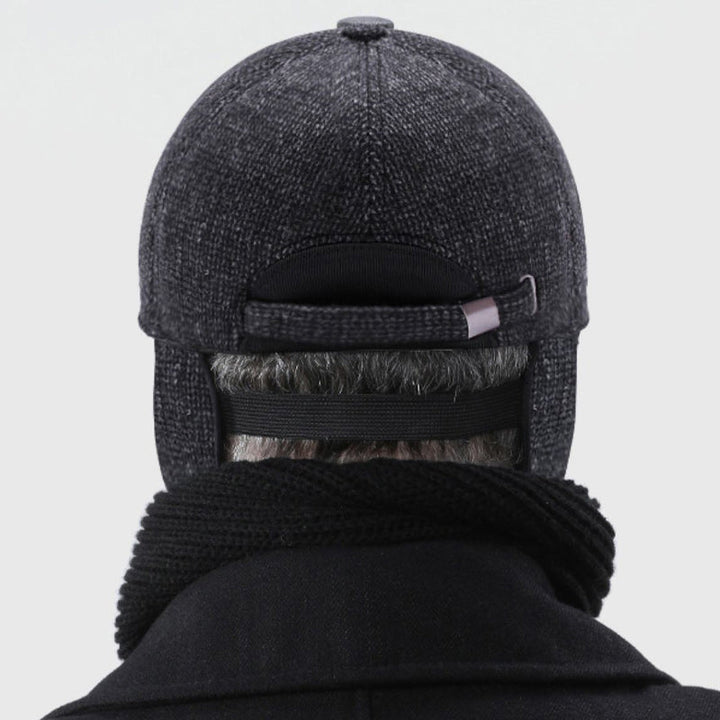 "Värmande unisex basebollkeps för vinter med öronskydd i grått, justerbar passform, perfekt för kalla dagar."