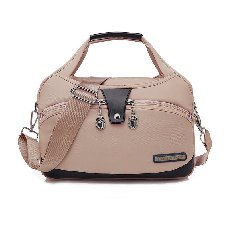 "Vattentät nylonhandväska för damer, justerbar rem, elegant design, perfekt för dagliga äventyr och organiserat innehåll."