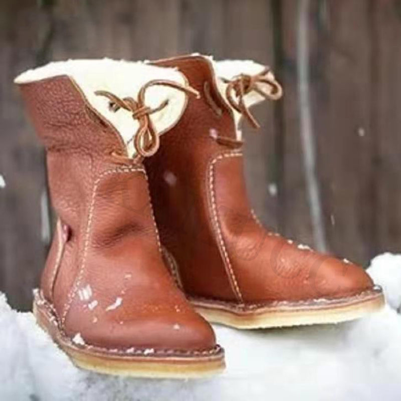 "Vattentäta snöstövlar för kvinnor i svart med plyschfoder och slitstark sula, perfekt för vinterdagar."