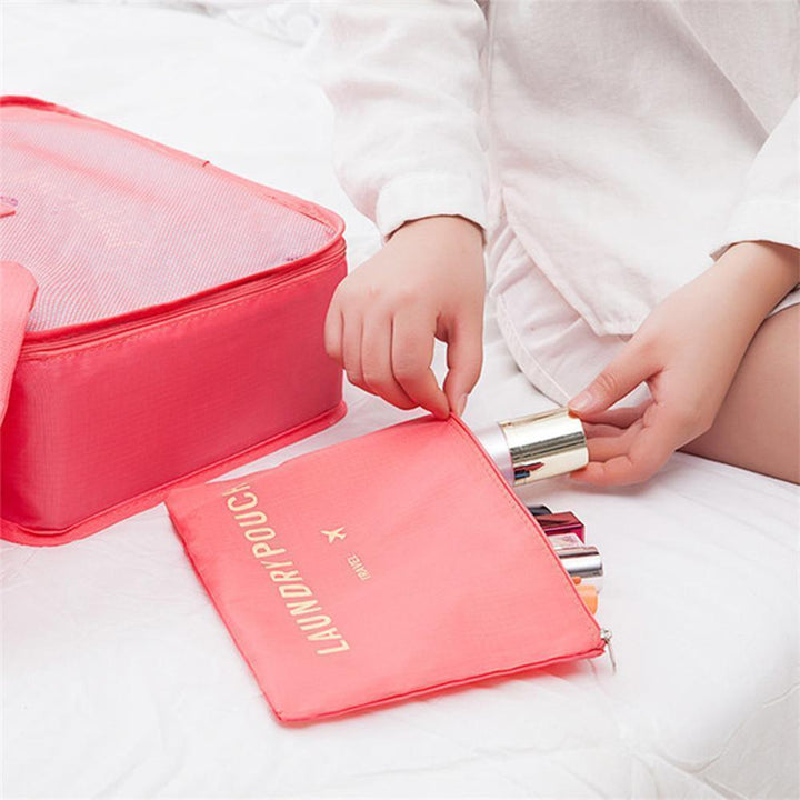 "Vattentätt resekitt för dam, 6 delar i oxfordduk, olika storlekar, grå nyanser, perfekt för ordnad packning."