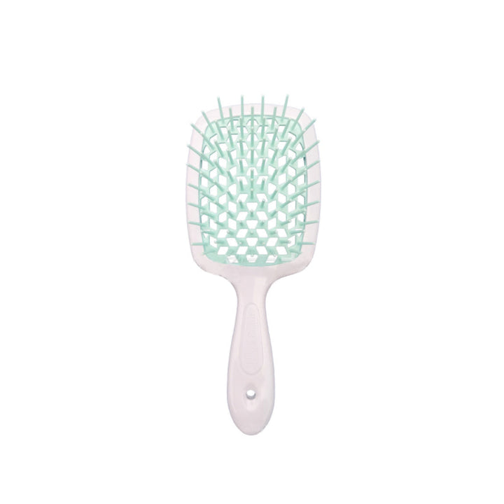 "Ventilerad avtrasslande hårborste i grönt, rosa, rött, svart, vitt. Effektiv för trasselfritt hår. Beauty & Wellbeing."