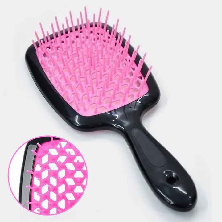 "Ventilerad avtrasslande hårborste i grönt, rosa, rött, svart, vitt. Effektiv för trasselfritt hår. Beauty & Wellbeing."