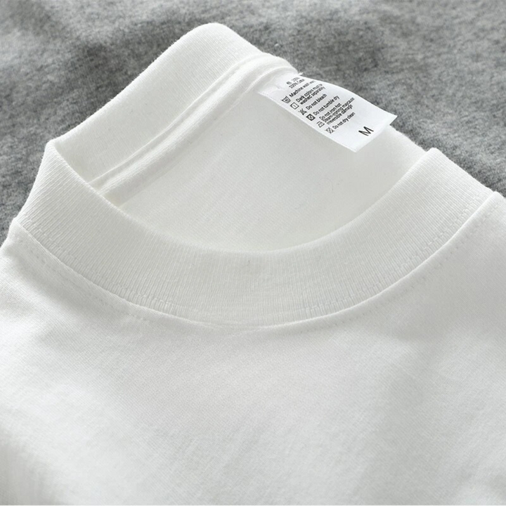 "Överdimensionerad t-shirt för män i bomull, enfärgad, avslappnad passform, kortärmad, rund hals, tungvikt tyg."