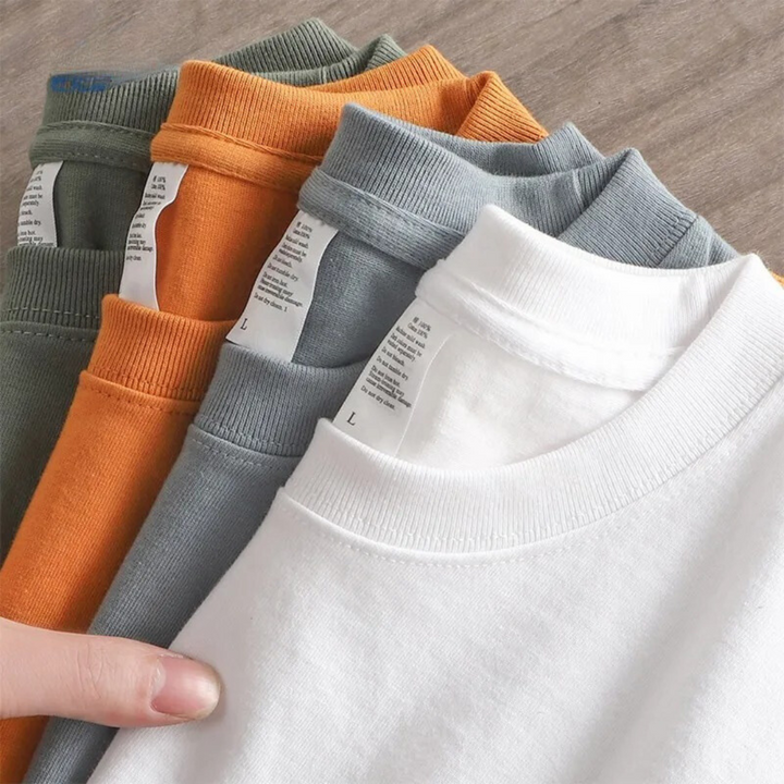 "Överdimensionerad t-shirt för män i bomull, enfärgad, avslappnad passform, kortärmad, rund hals, tungvikt tyg."