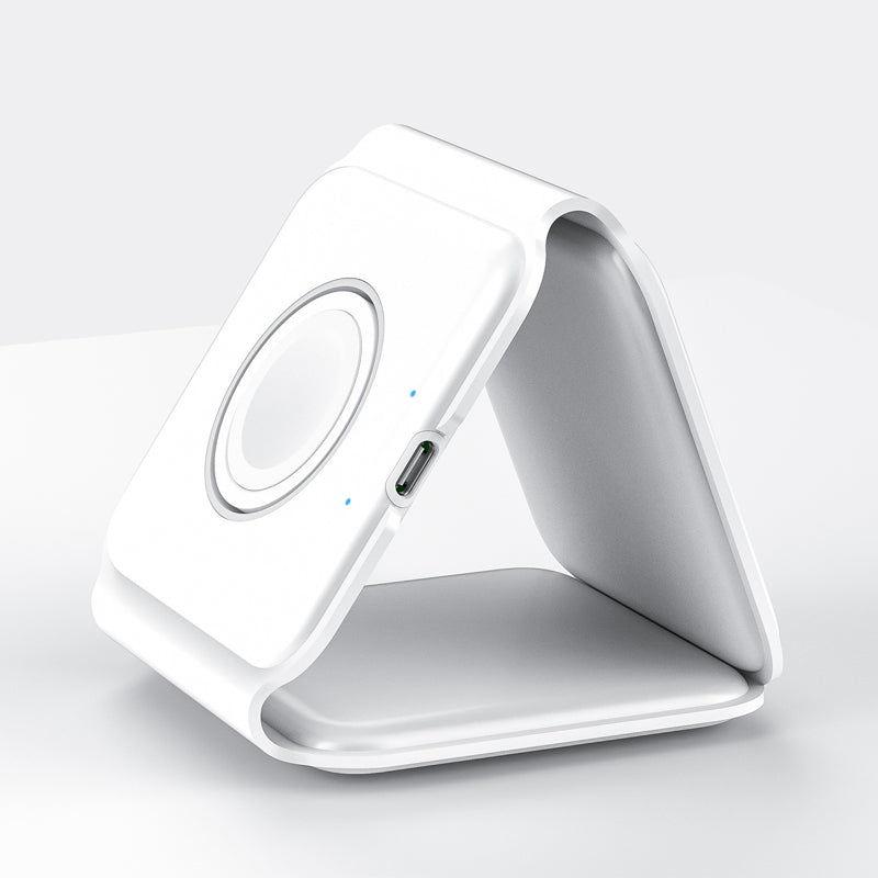 "Vikbar trådlös 3-i-1 laddstation i vit och svart, laddar mobil, AirPods, Apple Watch, sparar plats, stilren design."
