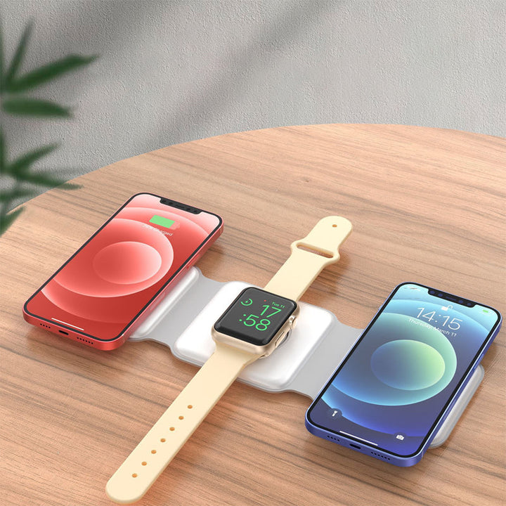 "Vikbar trådlös 3-i-1 laddstation i vit och svart, laddar mobil, AirPods, Apple Watch, sparar plats, stilren design."