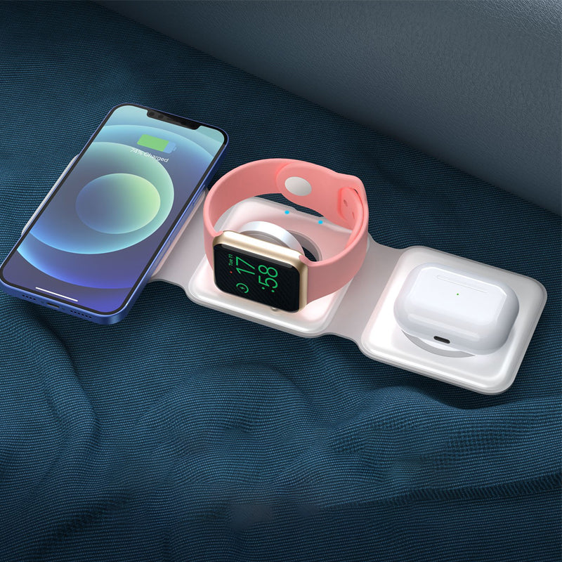 "Vikbar trådlös 3-i-1 laddstation i vit och svart, laddar mobil, AirPods, Apple Watch, sparar plats, stilren design."