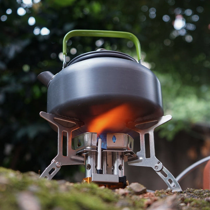 "Vindsäker camping gasbrännare, kompakt design, rostfritt stål, enkel tändning, stabil och perfekt för utomhusbruk."
