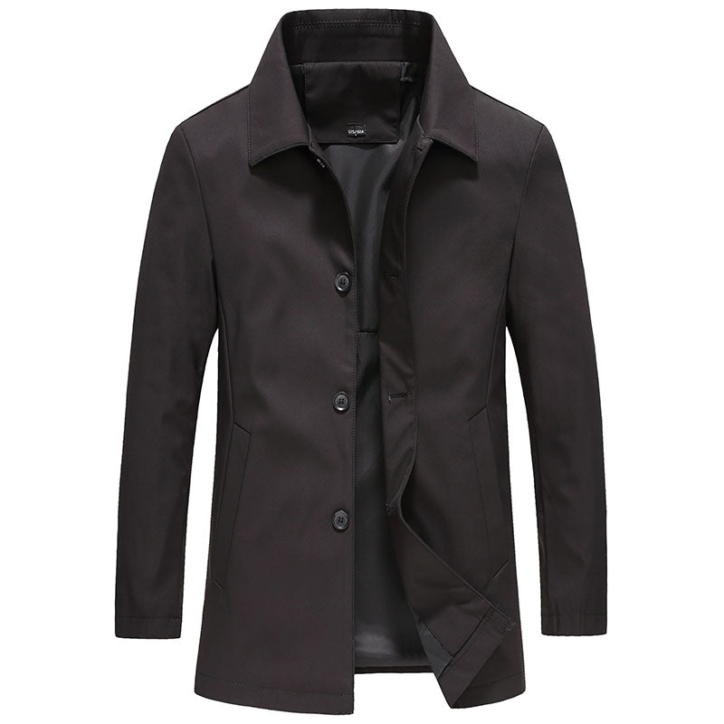 Elegant enfärgad herrjacka, lång och vindtät. Ytterkläder i stilrent höstmode, perfekt för blåsiga dagar.