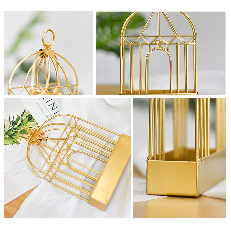 "Vintage myggspolehållare i smidesjärn, fågelbur design, elegant heminredning i gyllene och svart nyans."