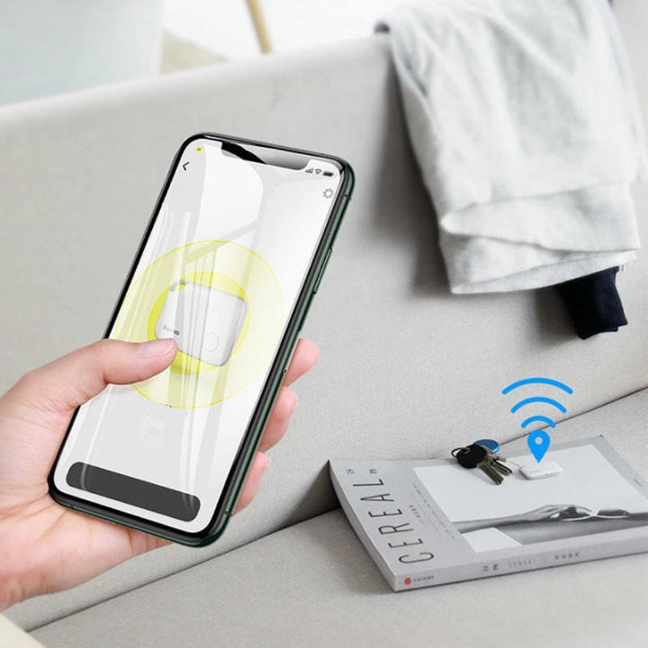 "Vit Bluetooth-spårare för förlorade föremål, kompakt och bärbar, idealisk för nycklar, husdjur och fordon."