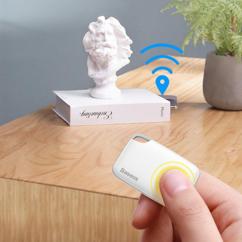 "Vit Bluetooth-spårare för förlorade föremål, kompakt och bärbar, idealisk för nycklar, husdjur och fordon."