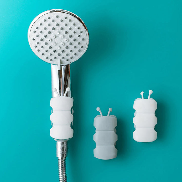 "Vit justerbar silikon duschhållare för duschhuvud, vattentät och lättinstallerad på släta ytor i badrummet."