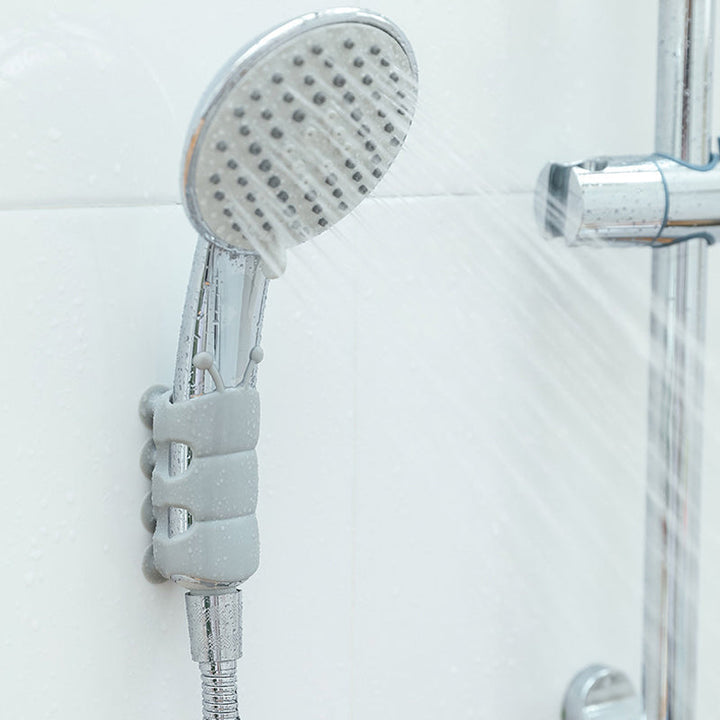 "Vit justerbar silikon duschhållare för duschhuvud, vattentät och lättinstallerad på släta ytor i badrummet."