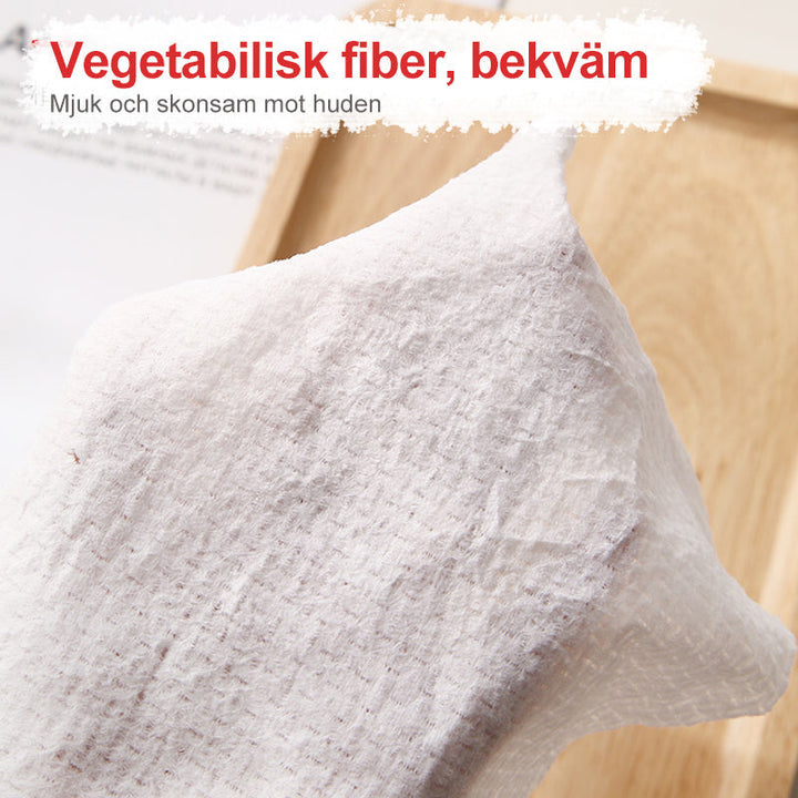 "Vit kompakt engångshandduk för resor, praktisk och platssparande, perfekt för hygien i farten."