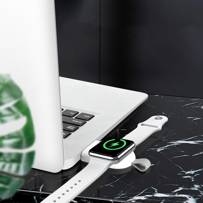 "Vit trådlös laddare för Apple-klocka, magnetisk och bärbar med kompakt design, perfekt för resor och snabb laddning."