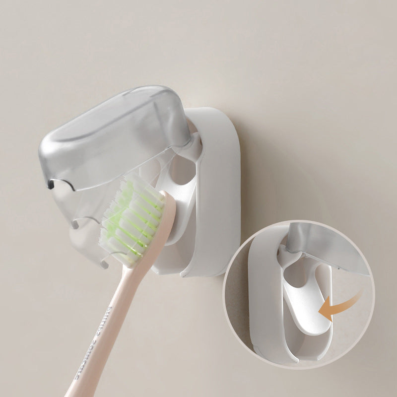 "Vit väggmonterad tandborsthållare i ABS-plast, med lock för hygienisk förvaring, platsbesparande design för små badrum."