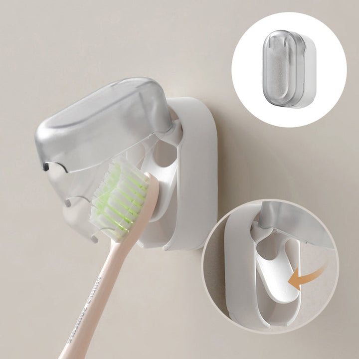 "Vit väggmonterad tandborsthållare i ABS-plast, med lock för hygienisk förvaring, platsbesparande design för små badrum."