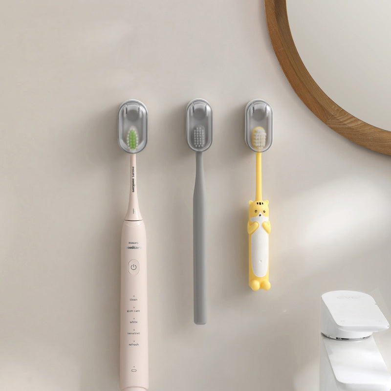 "Vit väggmonterad tandborsthållare i ABS-plast, med lock för hygienisk förvaring, platsbesparande design för små badrum."