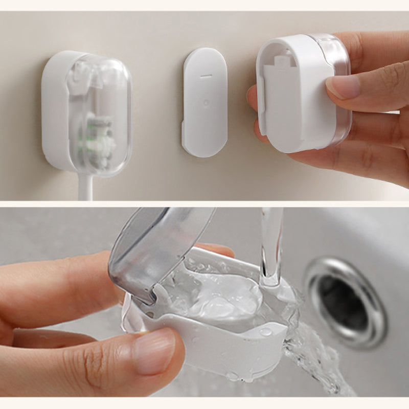 "Vit väggmonterad tandborsthållare i ABS-plast, med lock för hygienisk förvaring, platsbesparande design för små badrum."