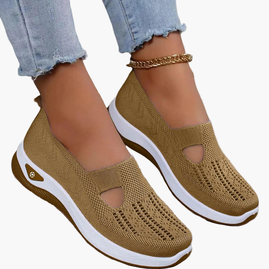 Ett par andningsbara ortopediska damsneakers med fotstöd, bekväma vardagsskor för friskare fötter året runt.