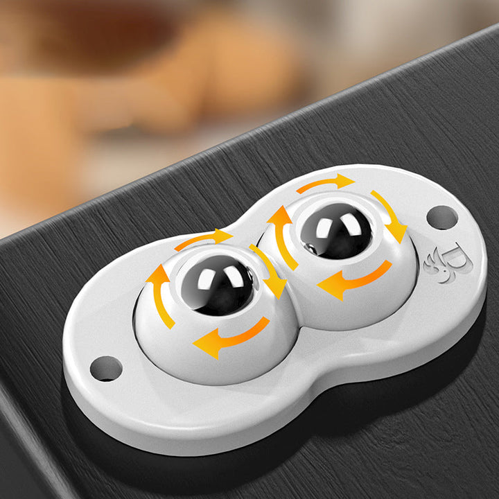 "Vita och svarta självhäftande mini 360° gummihjul; idealiska för enkel förflyttning av möbler och lådor i hemmet."